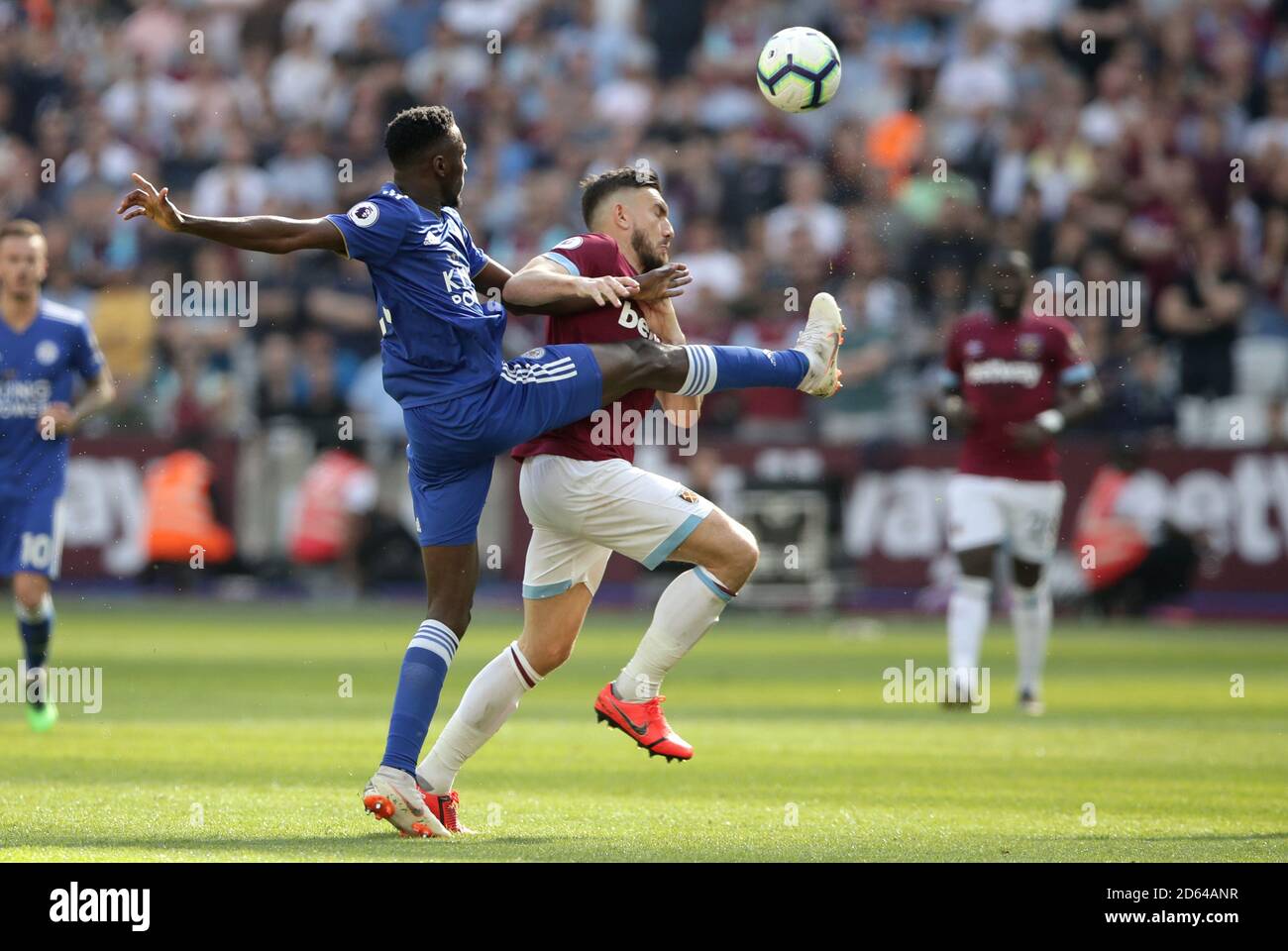 Leicester City's Wilfred Ndidi (left) and West Ham United's Robert Snodgrass battle for the ball Stock Photo