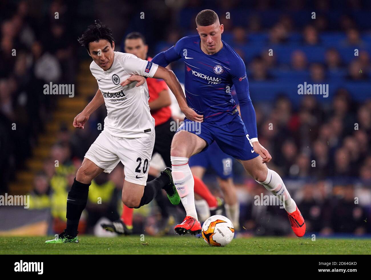 Chelsea's Ross Barkley (right) and Eintracht Frankfurt's Makoto Hasebe battle for the ball Stock Photo