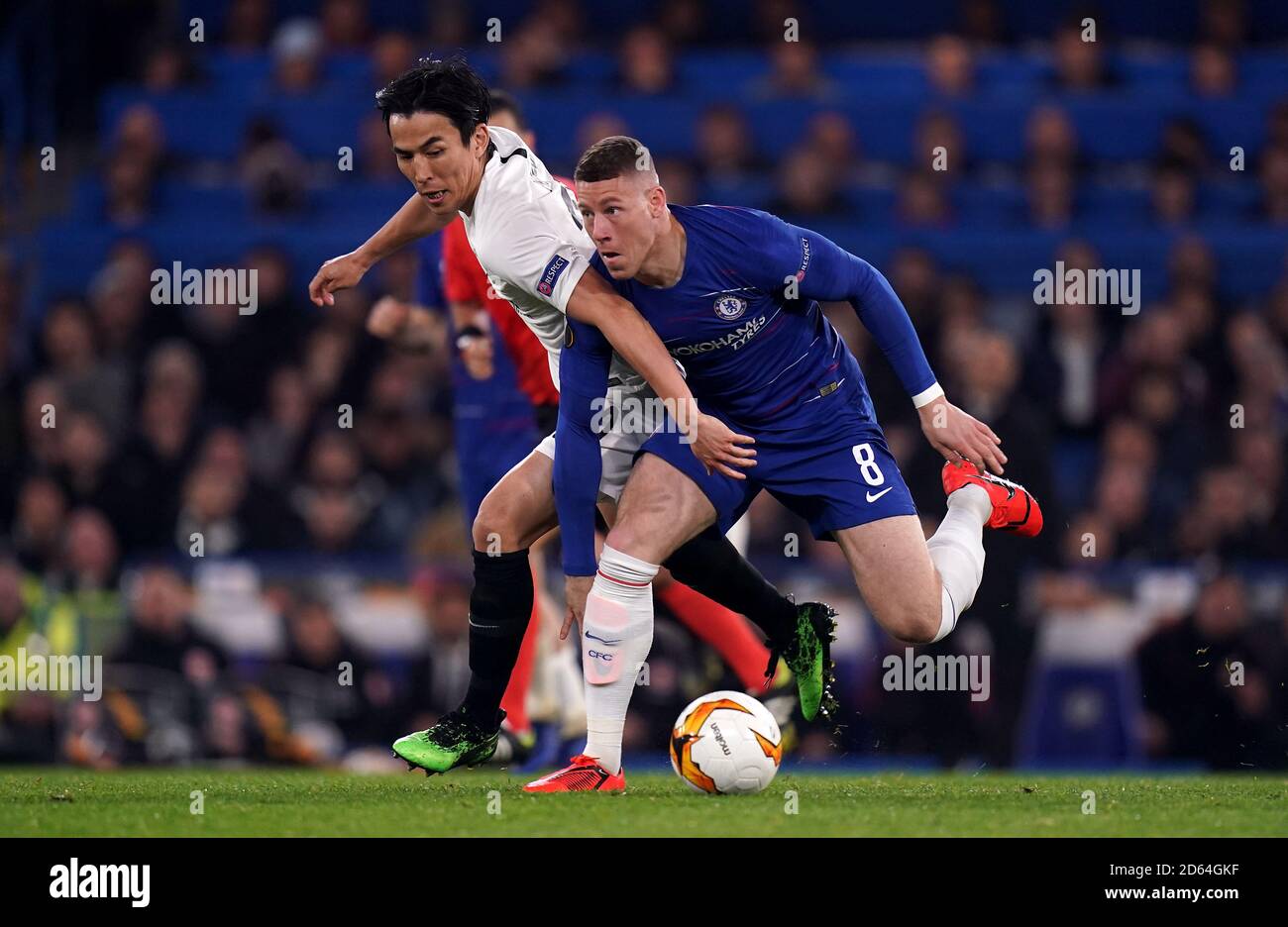 Chelsea's Ross Barkley (right) and Eintracht Frankfurt's Makoto Hasebe battle for the ball Stock Photo