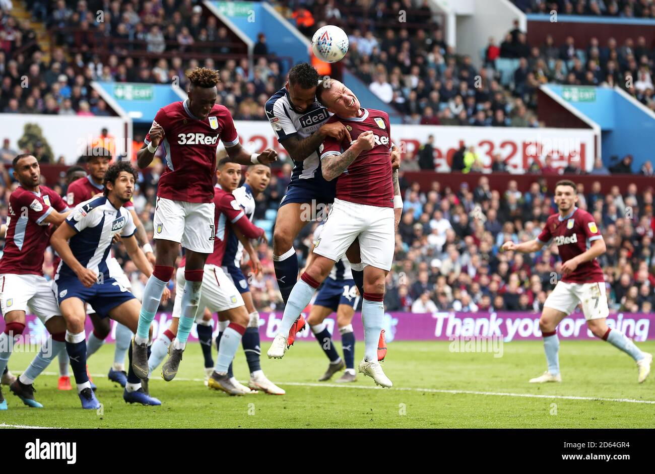 West Bromwich Albion's Kyle Bartley (centre) and Aston Villa's Glenn Whelan battle for the ball Stock Photo