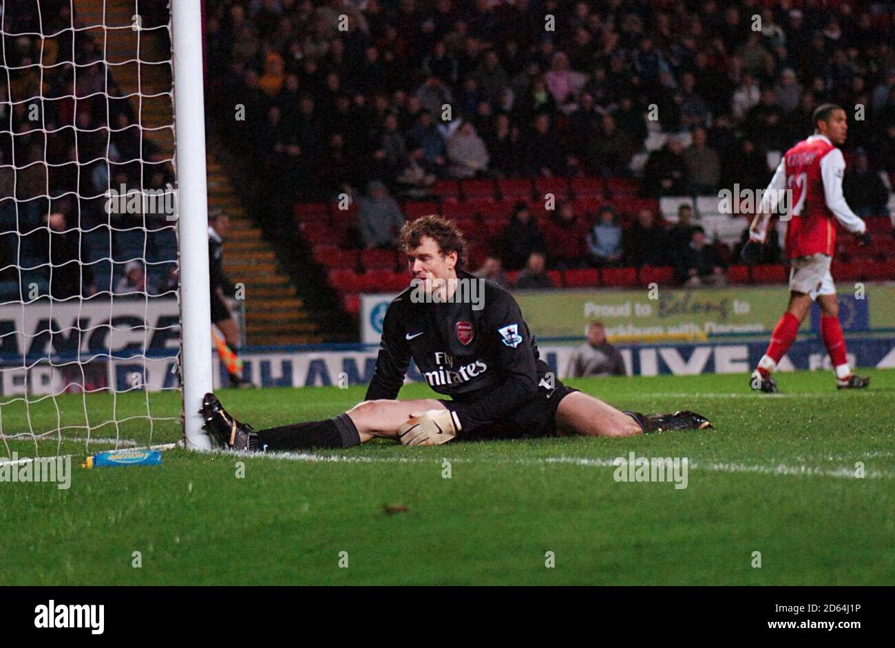 Arsenal goalkeeper Jens Lehmann (center) stretches to make a save to deny Blackburn Rovers Stock Photo