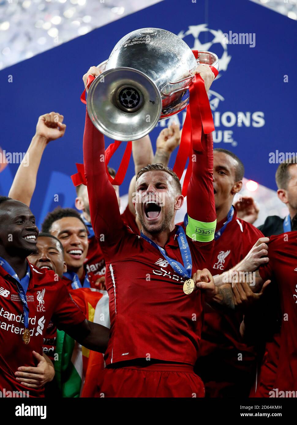Liverpool's Jordan Henderson celebrates with the trophy during the UEFA Champions League Final at the Wanda Metropolitano, Madrid. Stock Photo
