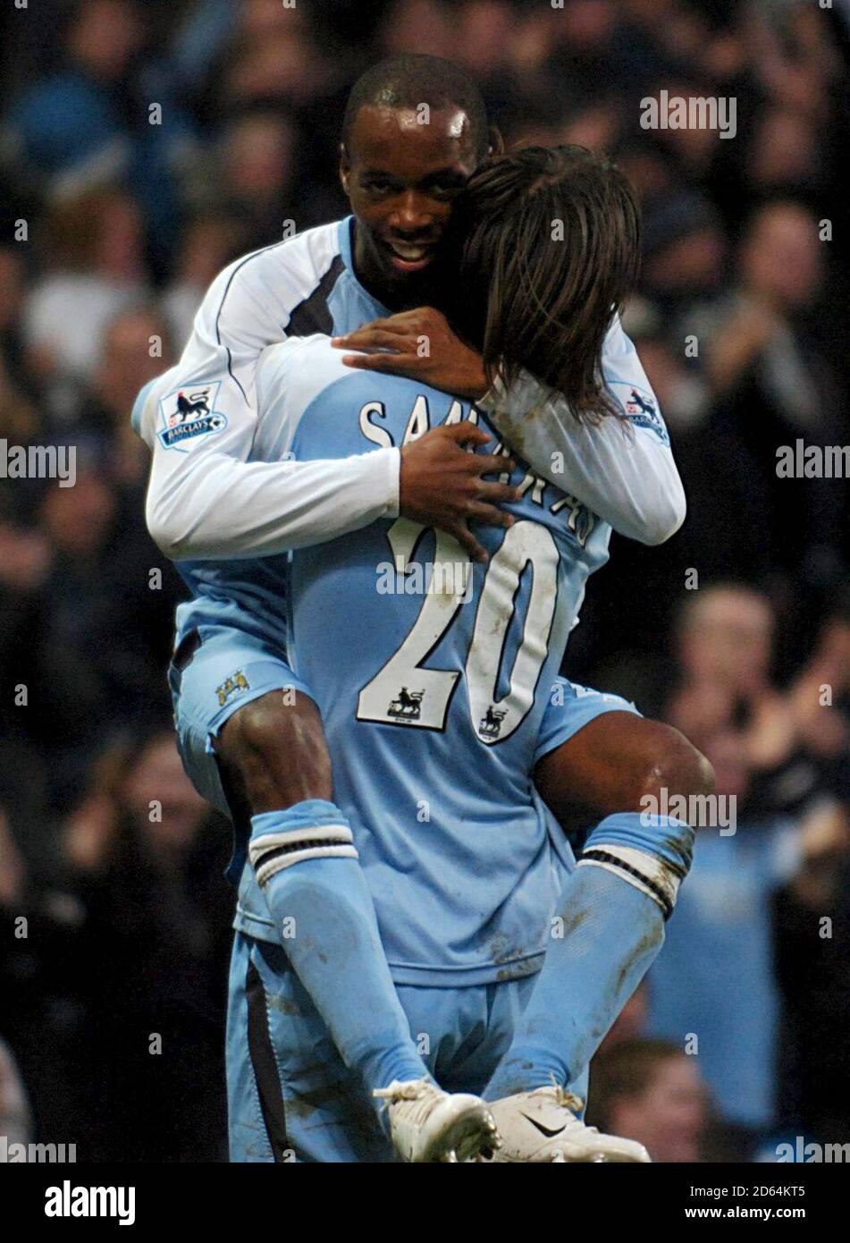 Manchester City's DaMarcus Beasley (top) celebrates scoring his sides third goal of the match with team mate Georgios Samaras Stock Photo
