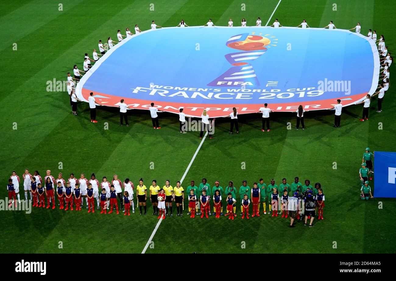 Players line up on the pitch prior to the beginning of the match Stock
