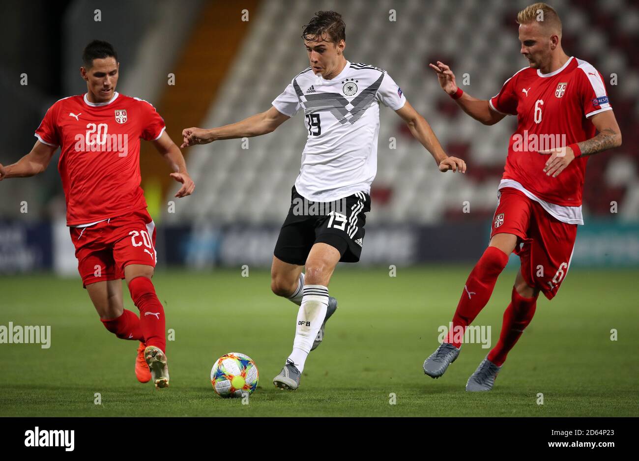 Germany U21's Florian Neuhaus (centre) in action with Serbia U21's Sasa Lukic (left) and Uros Racic Stock Photo