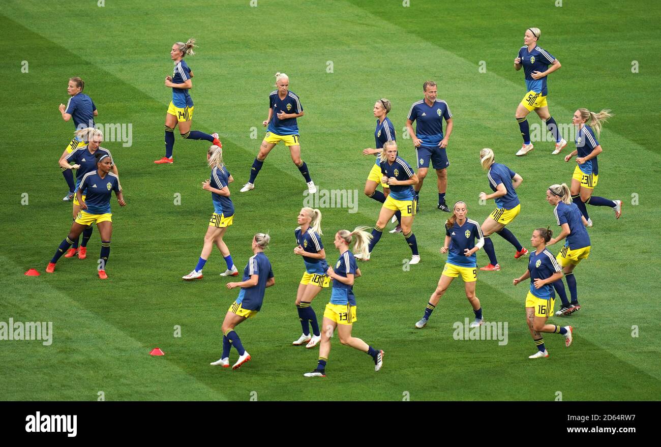 Sweden players warm up ahead of the match Stock Photo