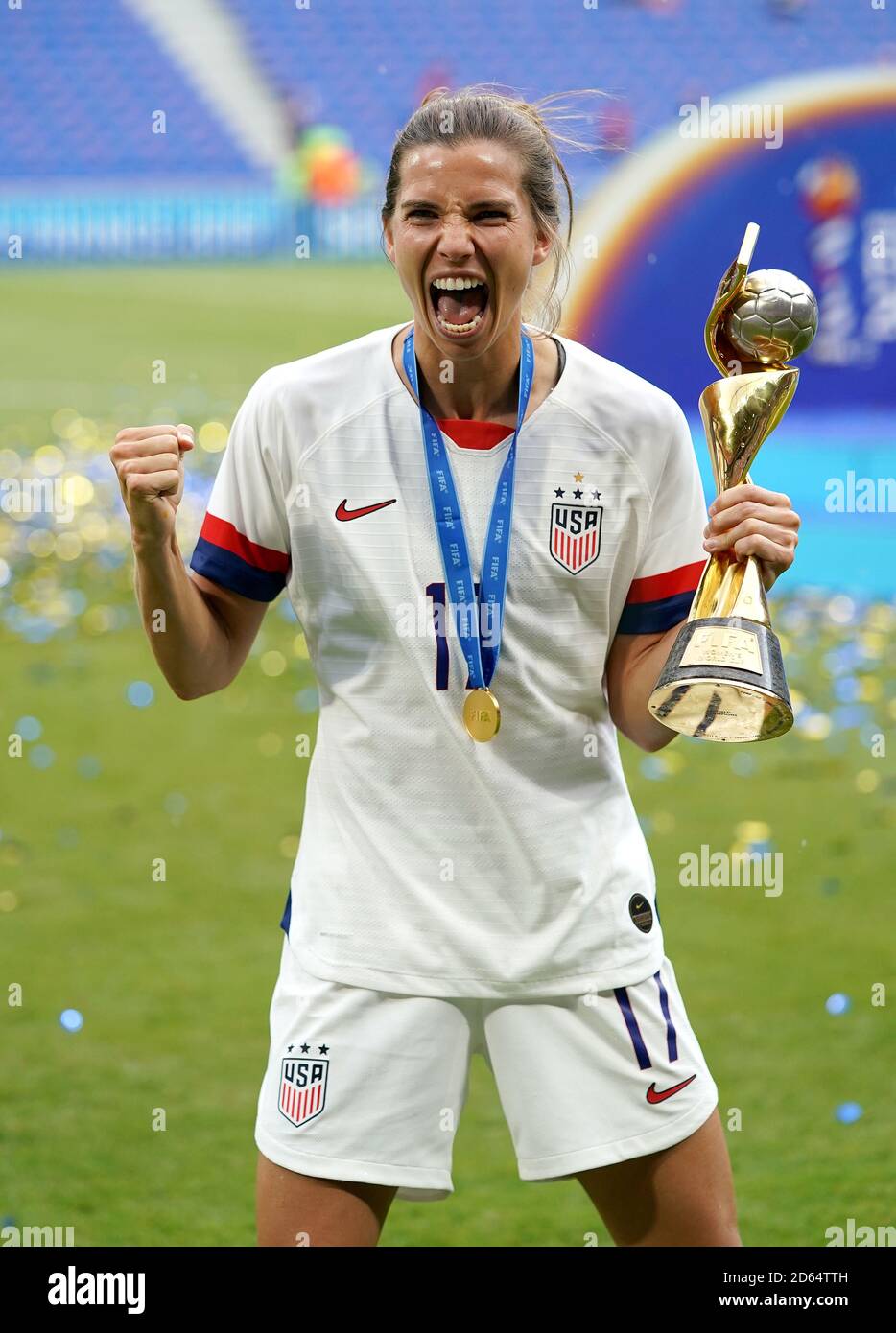 USA's Tobin Heath celebrates with the FIFA Women's World Cup Trophy