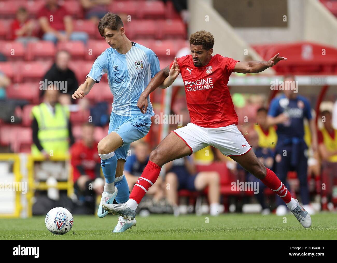 Swindon Town's Zeke Fryers and Coventry City's Tom Bayliss during the