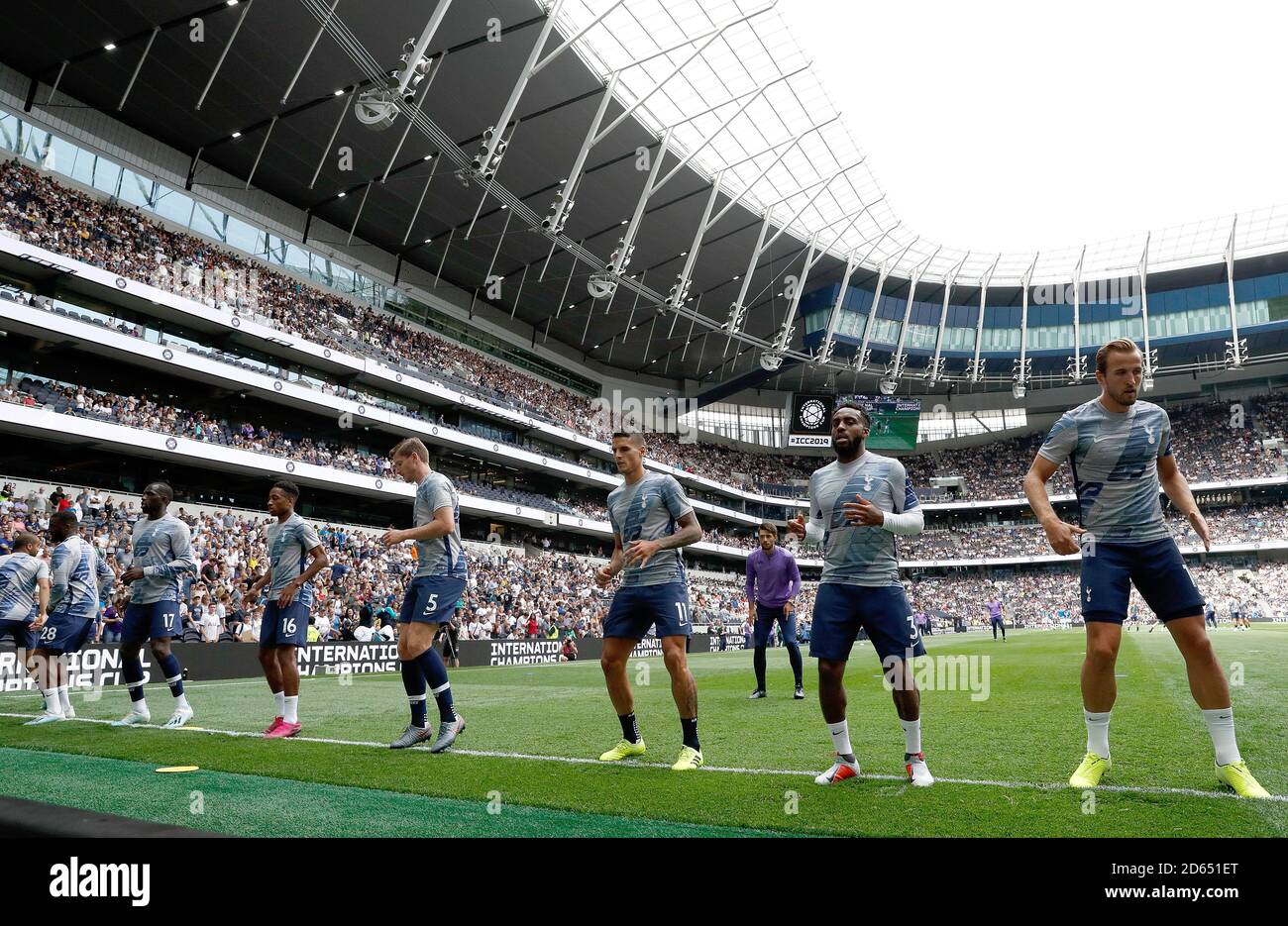 Tottenham Hotspur's Harry Kane (right) warms-up with team-mates before kick-off Stock Photo