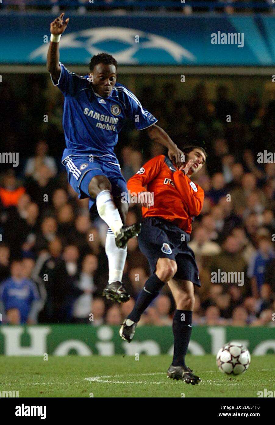 Chelsea's Michael Essien (left) battles for the ball with FC Porto's Lisandro Lopez. Stock Photo
