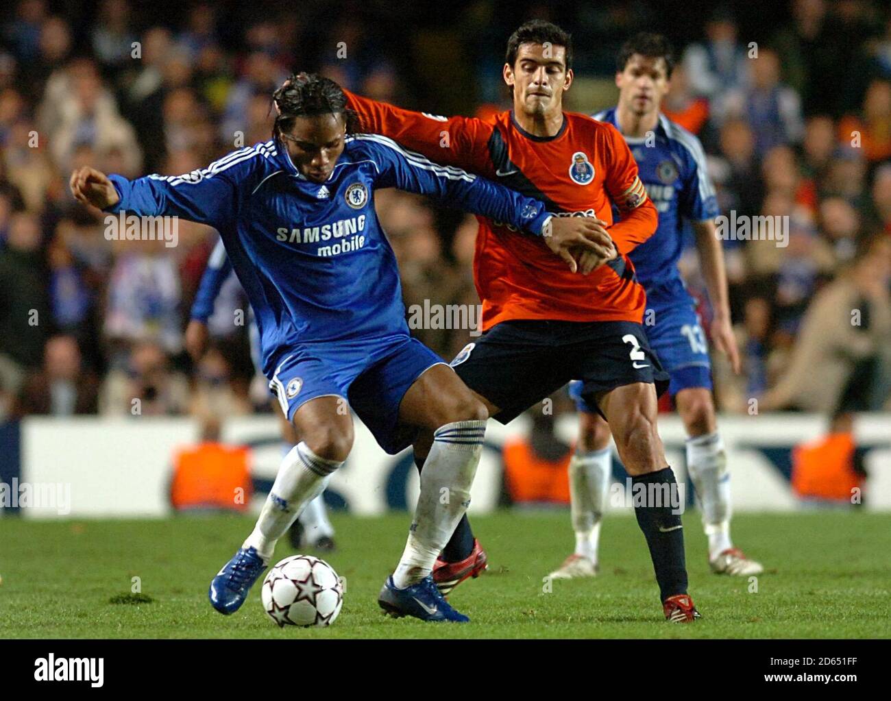 Chelsea's Didier Drogba (left) and FC Porto's Miguel Ricardo Costa battle for the ball. Stock Photo
