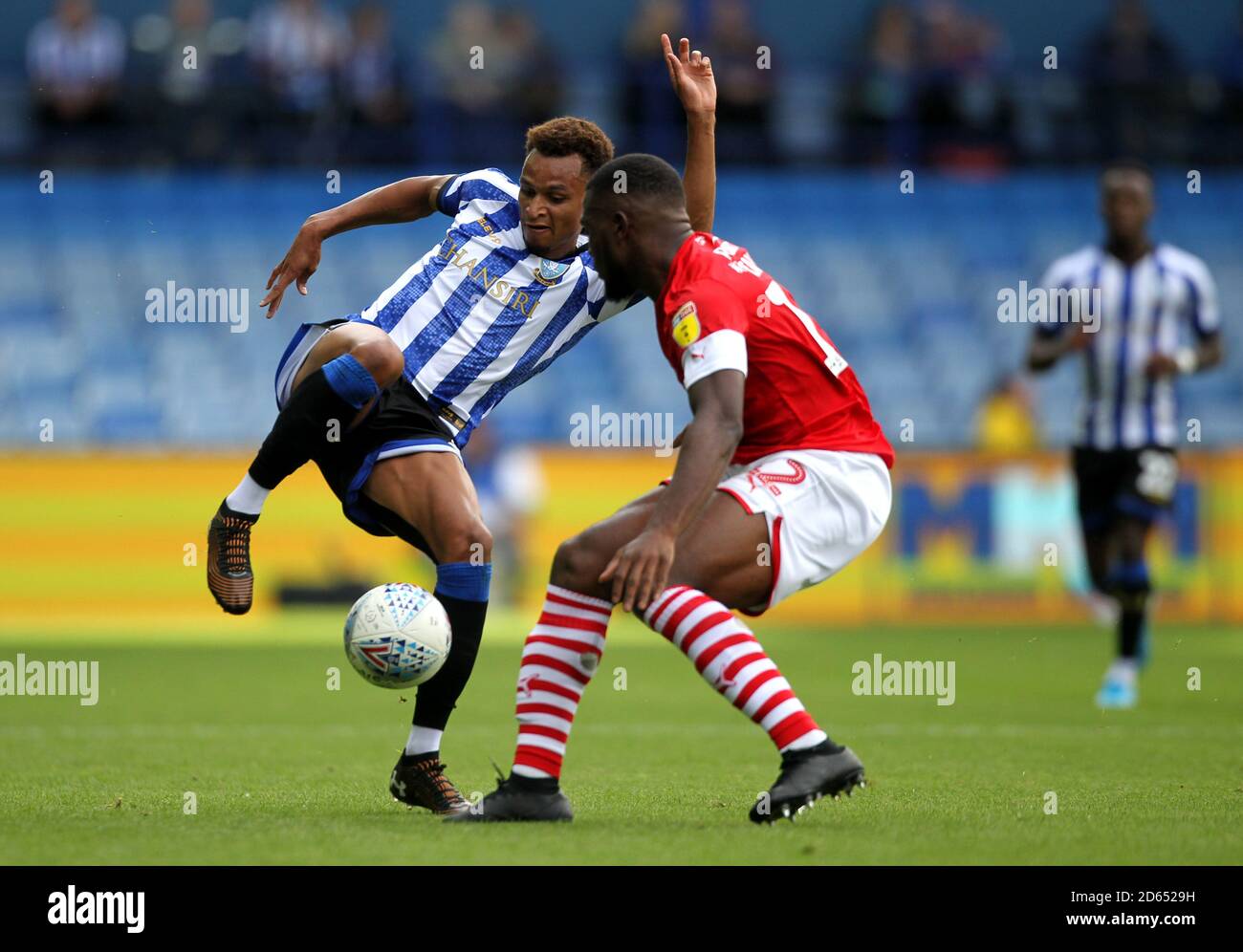 Sheffield Wednesday's Jacob Murphy (left) and Barnsley's Dimitri Cavare battle for the ball Stock Photo