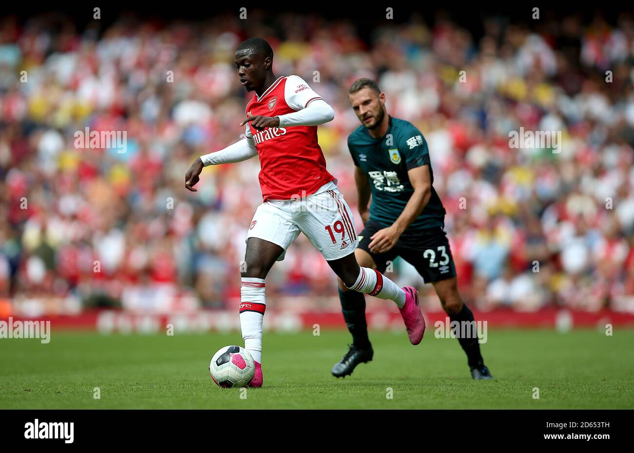 Arsenal's Nicolas Pepe (left) in action Stock Photo