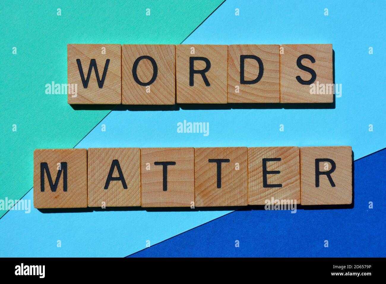 Words Matters, phrase in wooden alphabet letters isolated on blue background Stock Photo