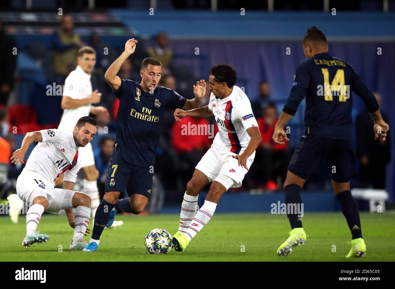 Real Madrid's Eden Hazard (second left) battles for the ball with Paris Saint Germain's Pablo Sarabia (left) and Aoas Correa Marquinhos Stock Photo