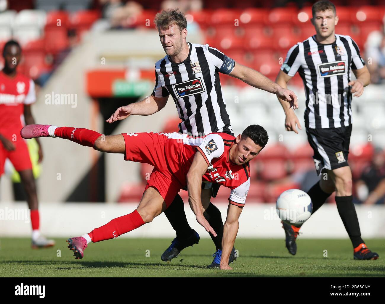 Kidderminster Harriers' Ed Williams and Stafford Rangers' Luke Jones during the FA Cup Second Round match at the Aggborough Stadium Stock Photo