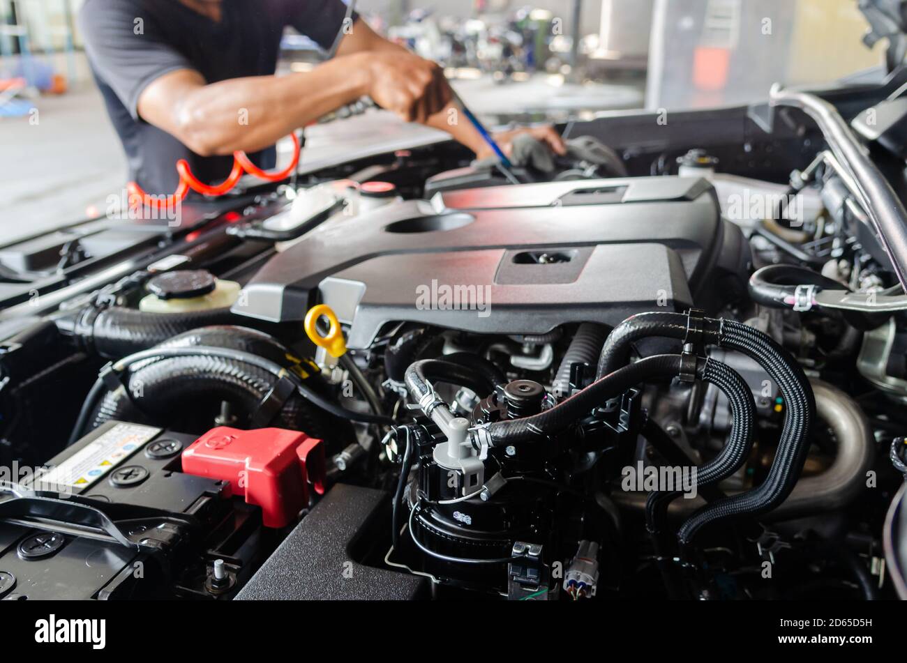 Process of cleaning the engine of a car with a spray Stock Photo Alamy