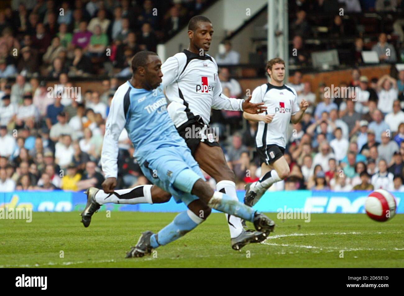 Manchester City's Darius Vassell (right) scores his sides third goal of the game. Stock Photo