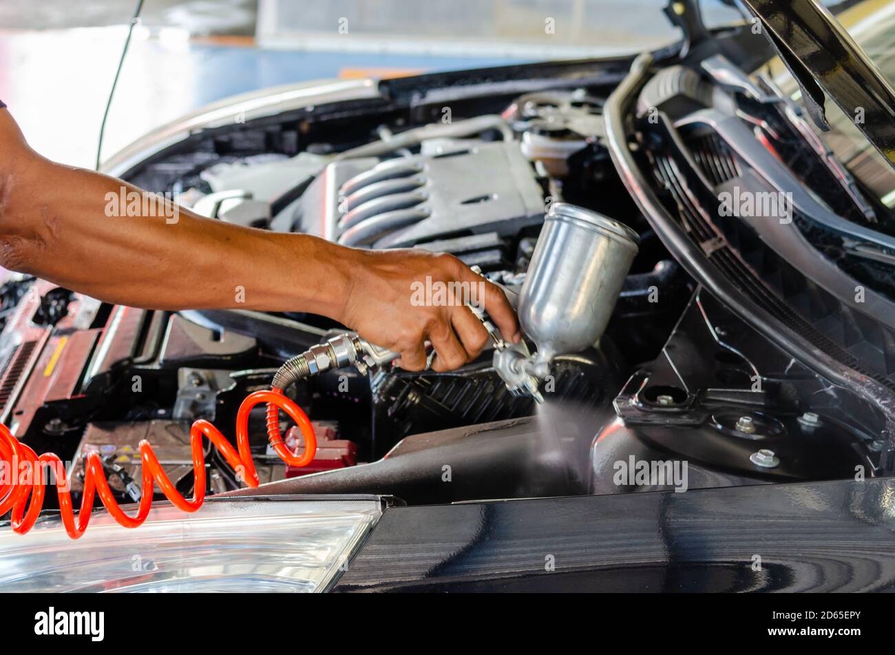 Process of cleaning the engine of a car with a spray Stock Photo Alamy