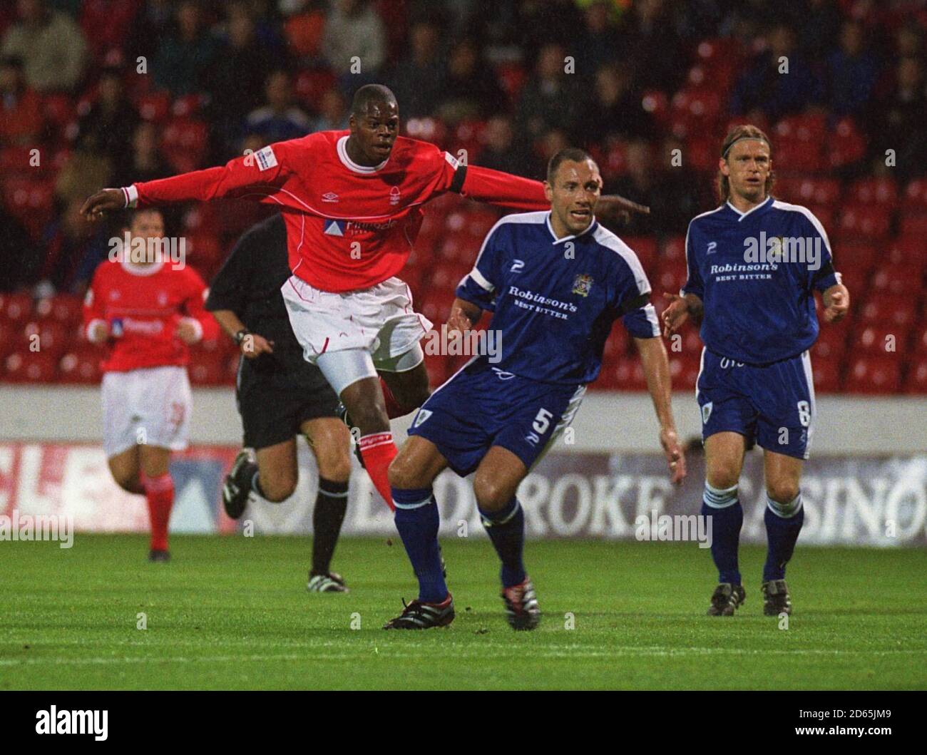 Nottingham Forest's Marlon Harewood looks on with Stockport County's Mike Flynn and Richard Sneekes as Harewood's shot goes just wide of the goal Stock Photo