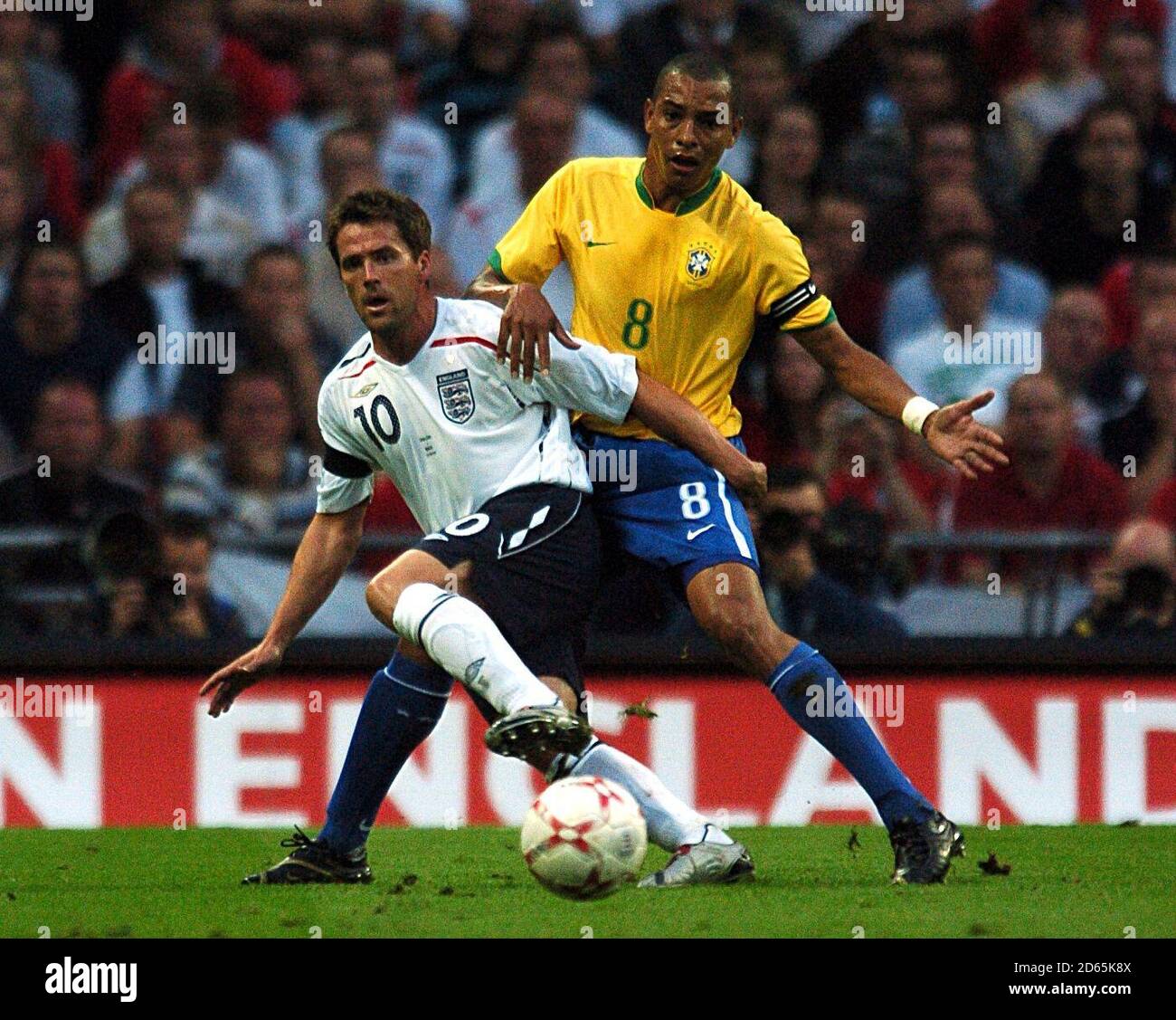 England's Michael Owen and Brazil's Gilberto Silva battle for the ball Stock Photo