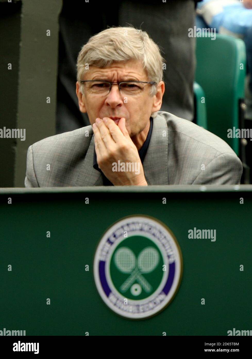 Arsenal manage Arsene Wenger looks on as he watches Justine Henin in action against Patty Schnyder Stock Photo