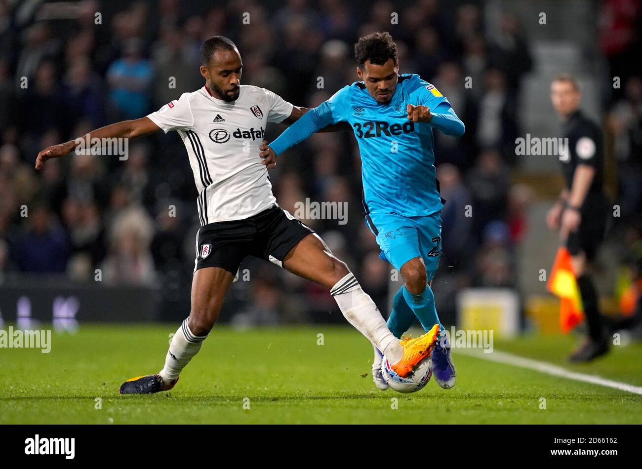 Fulham's Denis Odoi (left) and Derby County's Duane Holmes battle for the ball Stock Photo