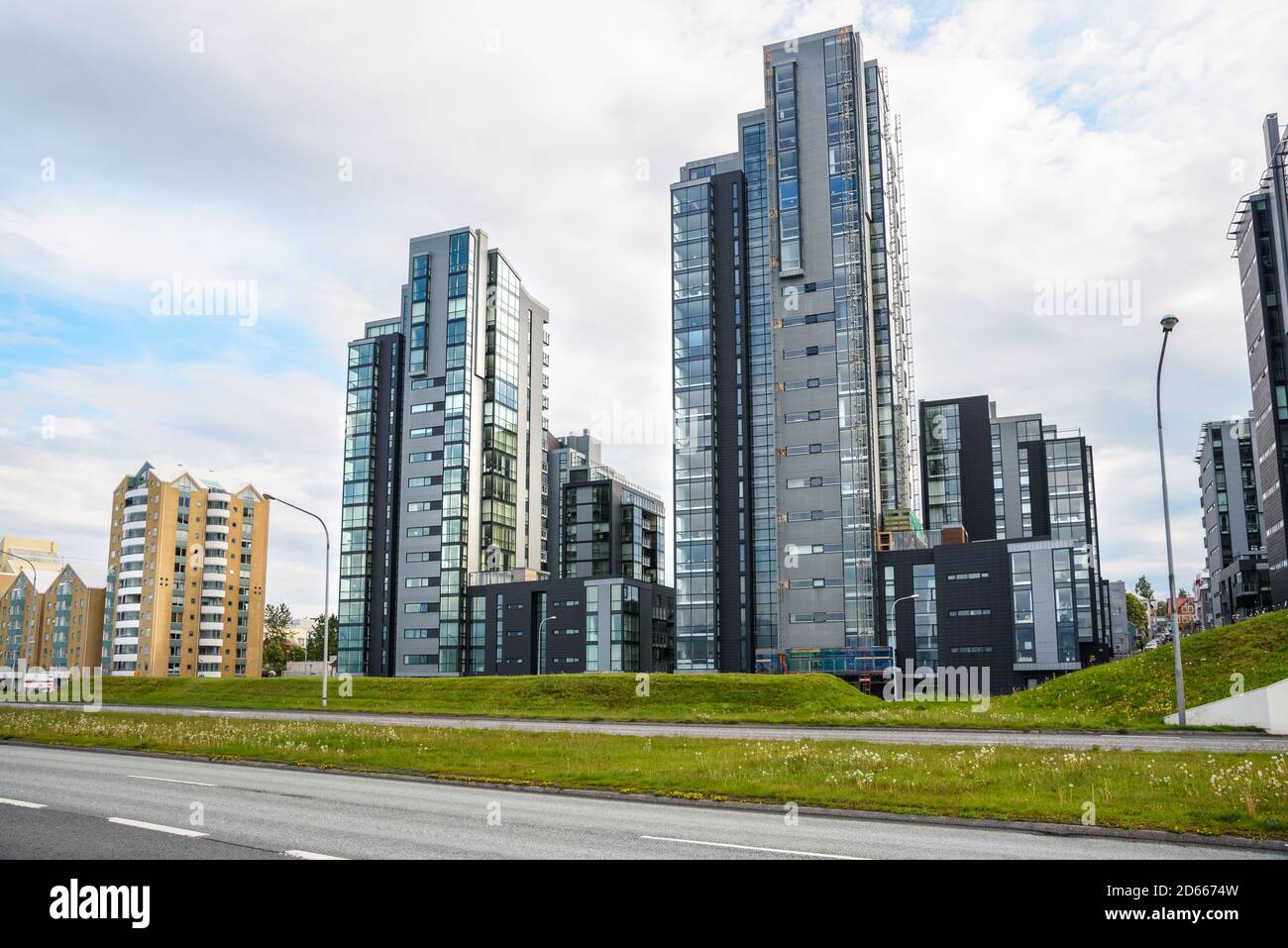 Newly built high rise apartment buildings along a major urban road Stock Photo