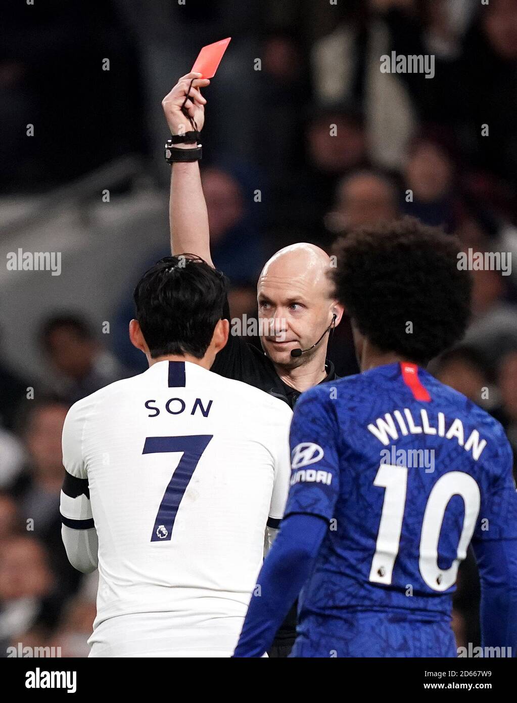 Tottenham Hotspur's Son Heungmin is shown a red card by referee