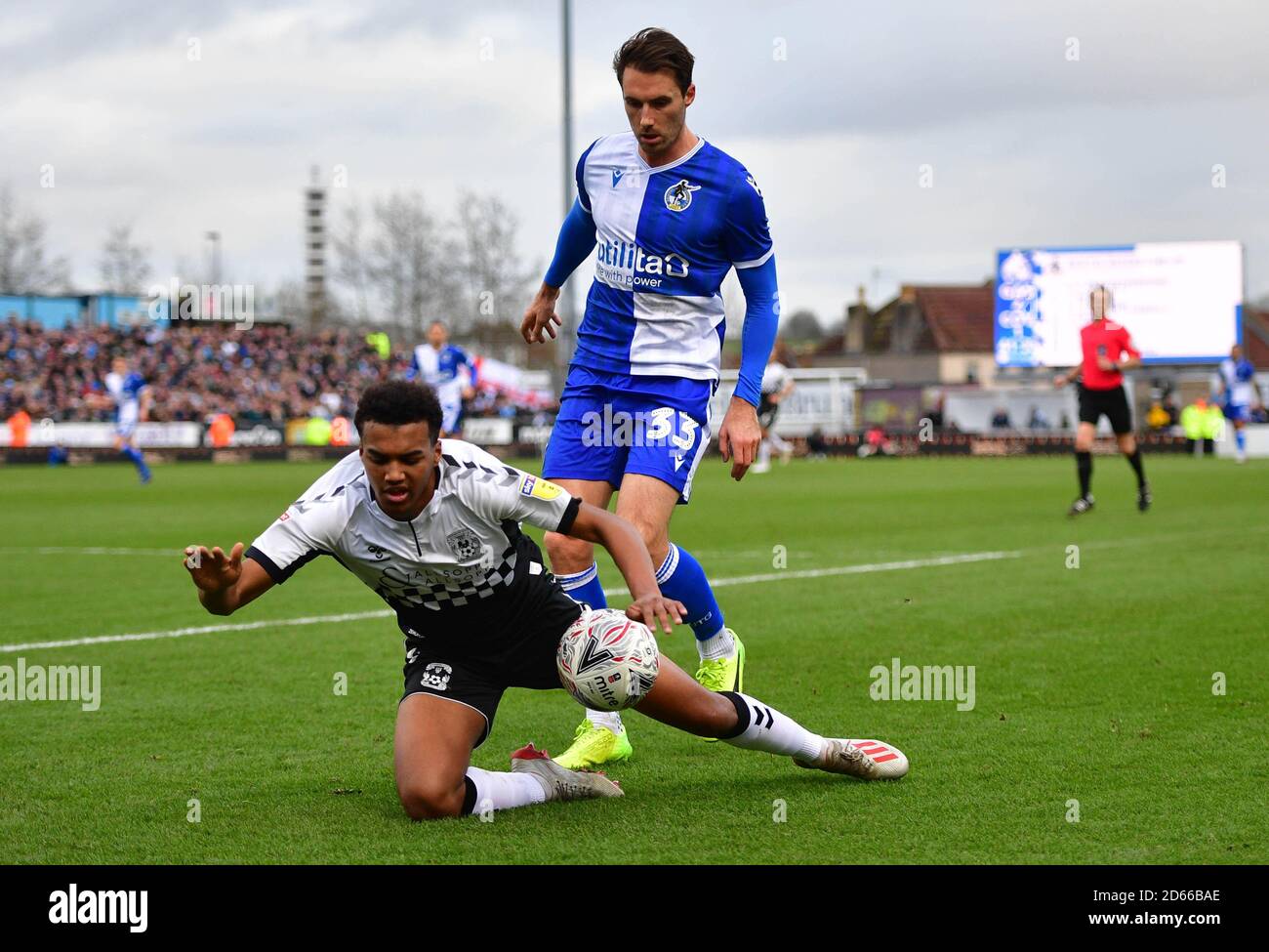 Bristol Rovers Alex Rodman (left) and Coventry City's Sam McCallum battle for the ball Stock Photo