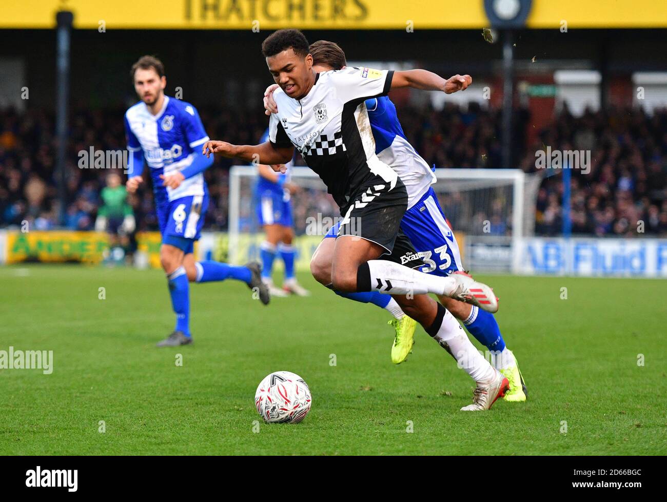 Coventry City's Sam McCallum and Bristol Rovers Alex Rodman (behind) battle for the ball Stock Photo