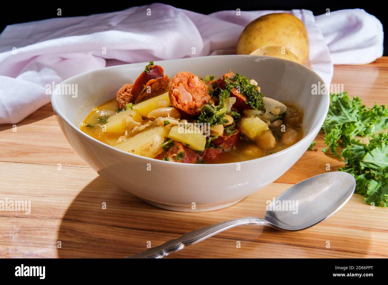 Traditional Portuguese caldo verde linguica sausage soup with kale and