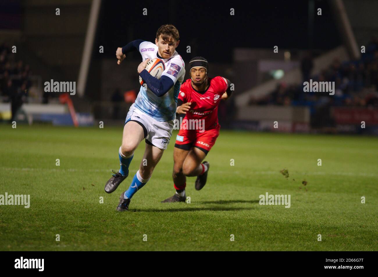 Manchester, England, 7 February 2020. Elliot Obatoyinbo of Saracens chasing Simon Hammersley of Sale Sharks who is running with the ball during their Gallagher Premiership Cup semi final match at the A J Bell Stadium. Stock Photo