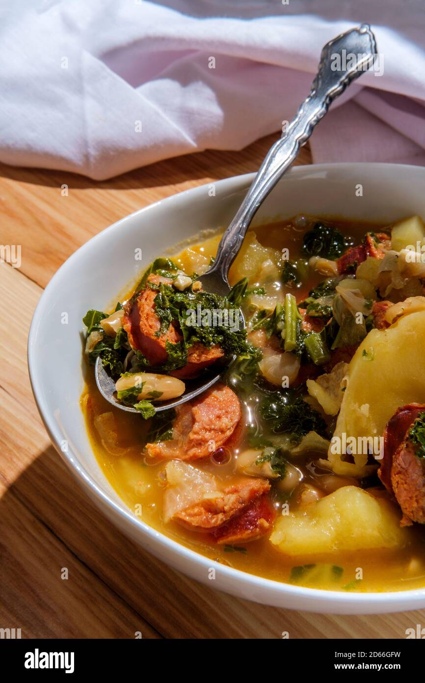 Traditional Portuguese caldo verde linguica sausage soup with kale and yukon gold potatoes Stock