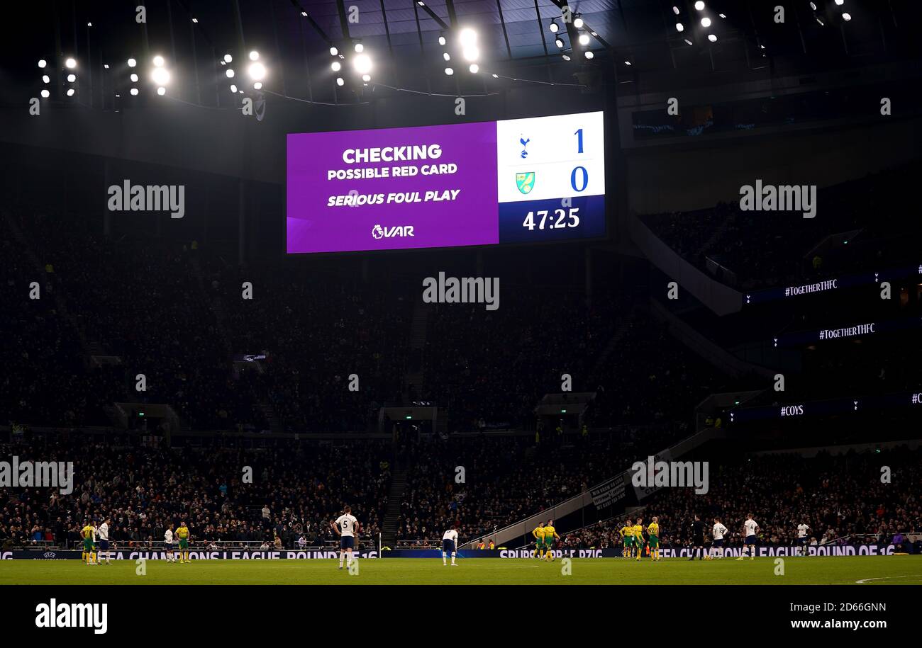 The big screen displays a VAR check for a possible red card for serious foul play which is later not given Stock Photo
