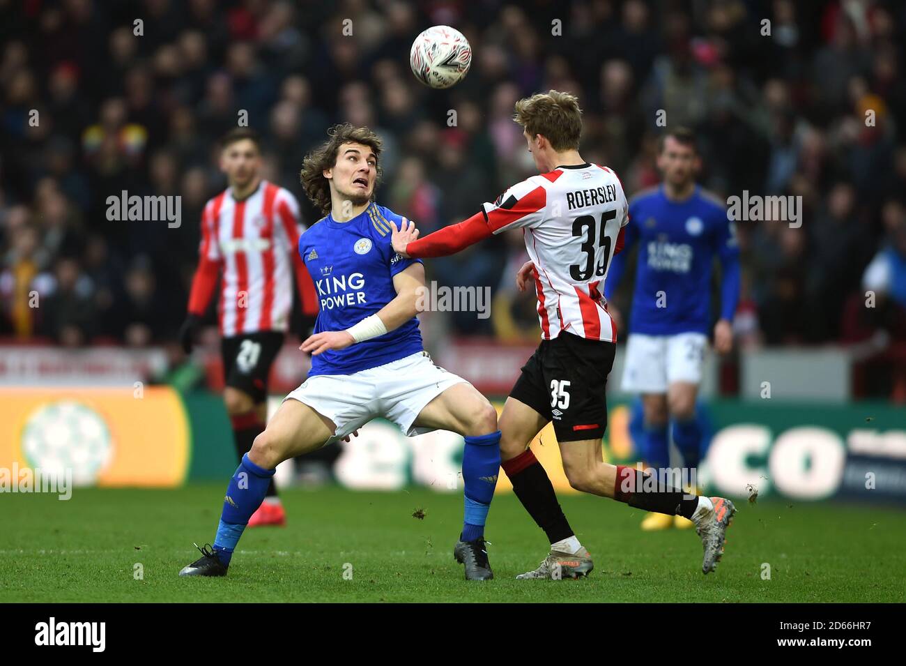 Leicester City's Caglar Soyuncu (left) and Brentford's Mads Roerslev Rasmussen battle for the ball  Stock Photo