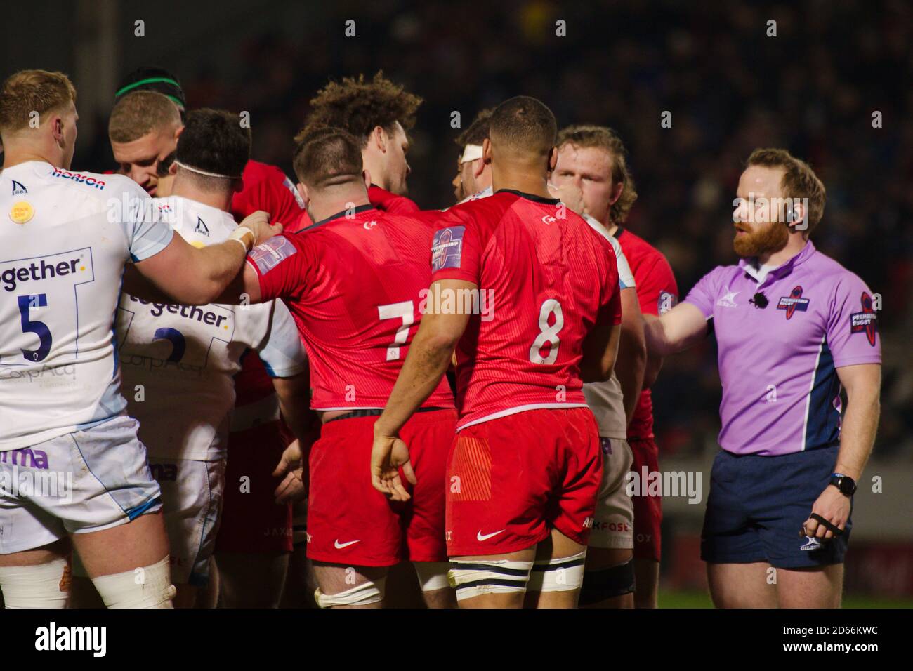 Manchester, England, 7 February 2020. Gallagher Premiership referee Hamish Smales separating players from Sale Sharks and Saracens during the Gallagher Premiership Cup semi final at the A J Bell Stadium. Stock Photo