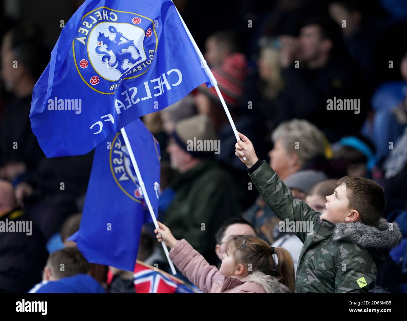 Chelsea fans wave flags during the game Stock Photo Alamy