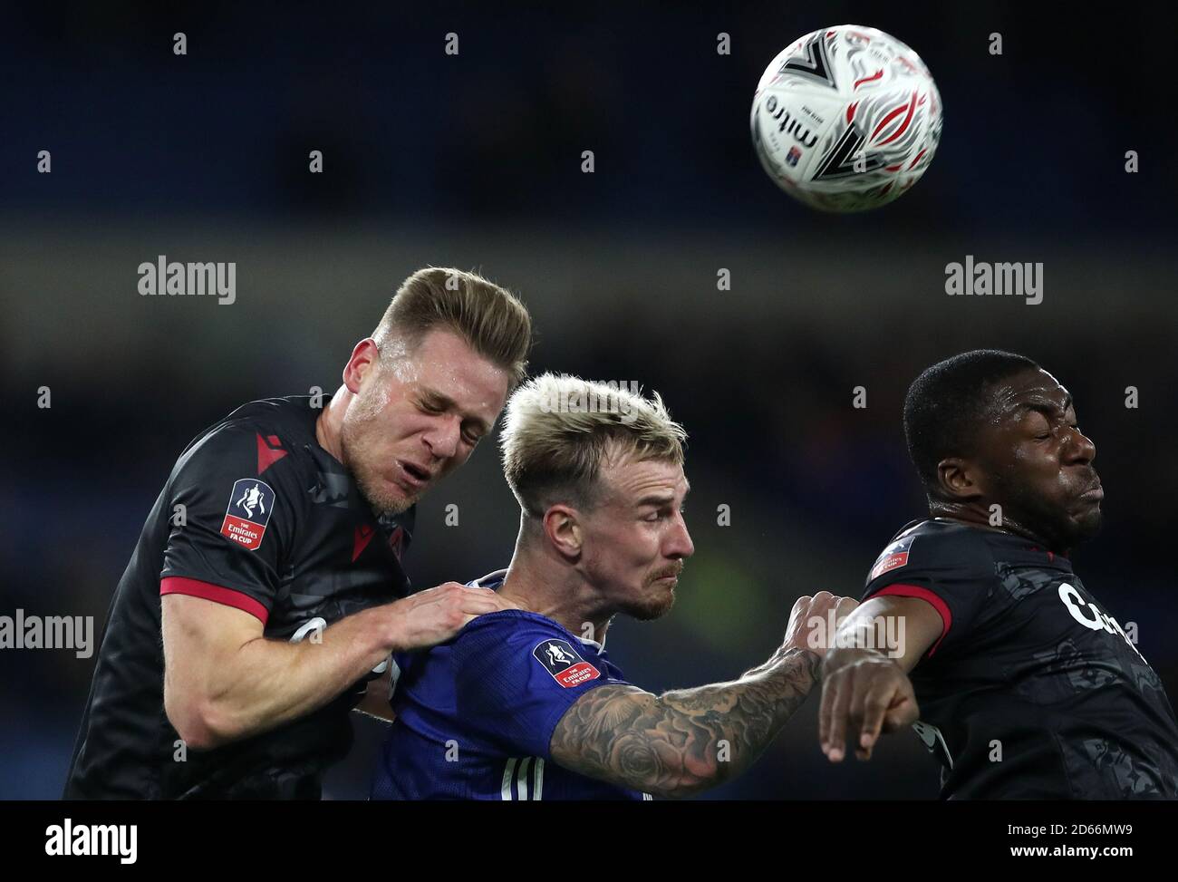Reading's Michael Morrison, Cardiff City's Aden Flint and Reading's Yakou Meite battle for the ball Stock Photo