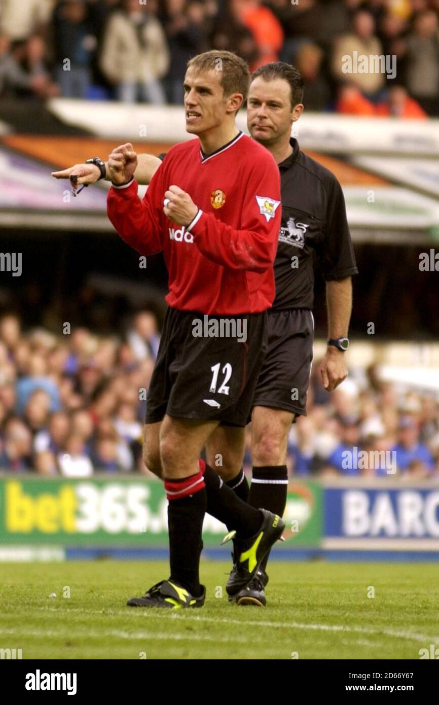 Phil Neville of Manchester United clenches his fists celebrating the