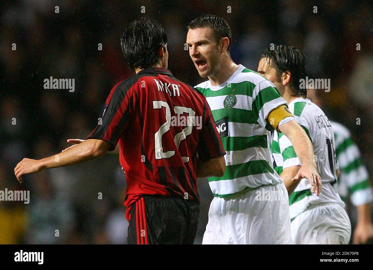 Celtic captain Stephen McManus (right) has words with AC Milan's Ricardo Kaka. Stock Photo