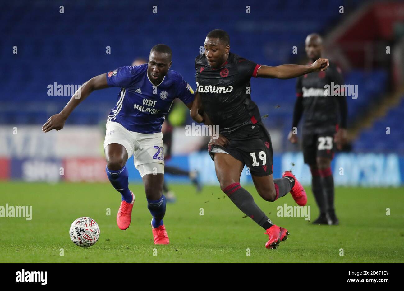 Cardiff City's Sol Bamba battles for the ball with Reading's Yakou Meite   Stock Photo