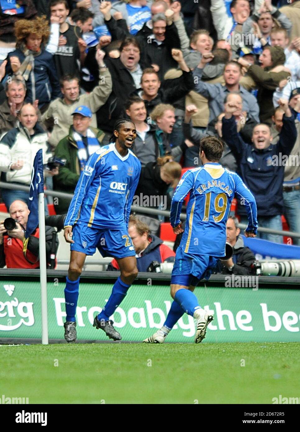 Portsmouth's Nwankwo Kanu celebrates scoring his sides first goal of the game with teammate Niko Kranjcar (right) Stock Photo