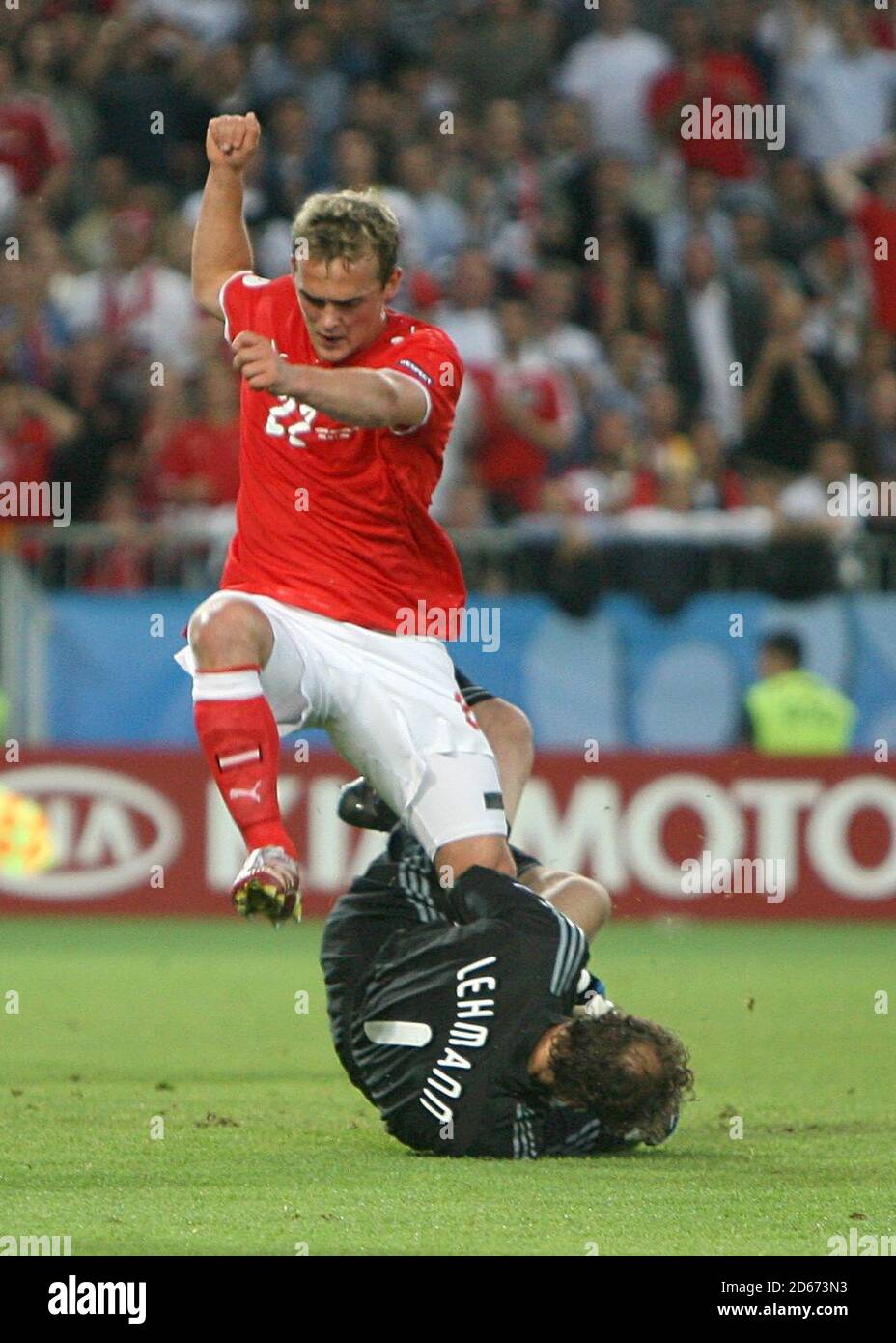 Austria's Erwin Hoffer collides with Germany's goalkeeper Jens Lehmann as they go for the ball Stock Photo