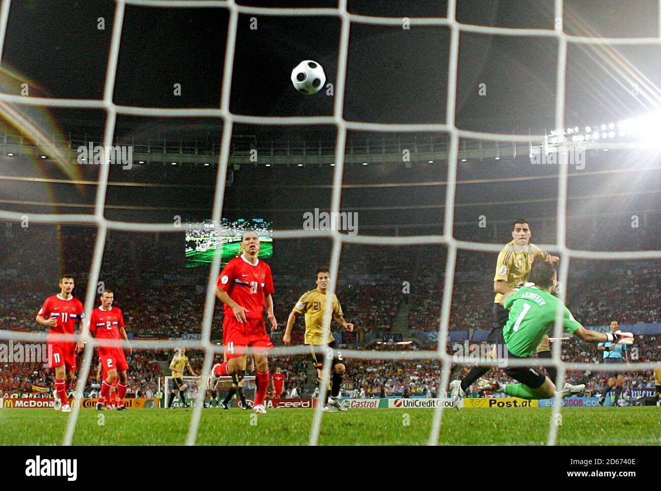 Spain's Daniel Guiza (2nd right) chips over Russia's goalkeeper Igor Akinfeev (r) to score Spain's second goal of the game Stock Photo
