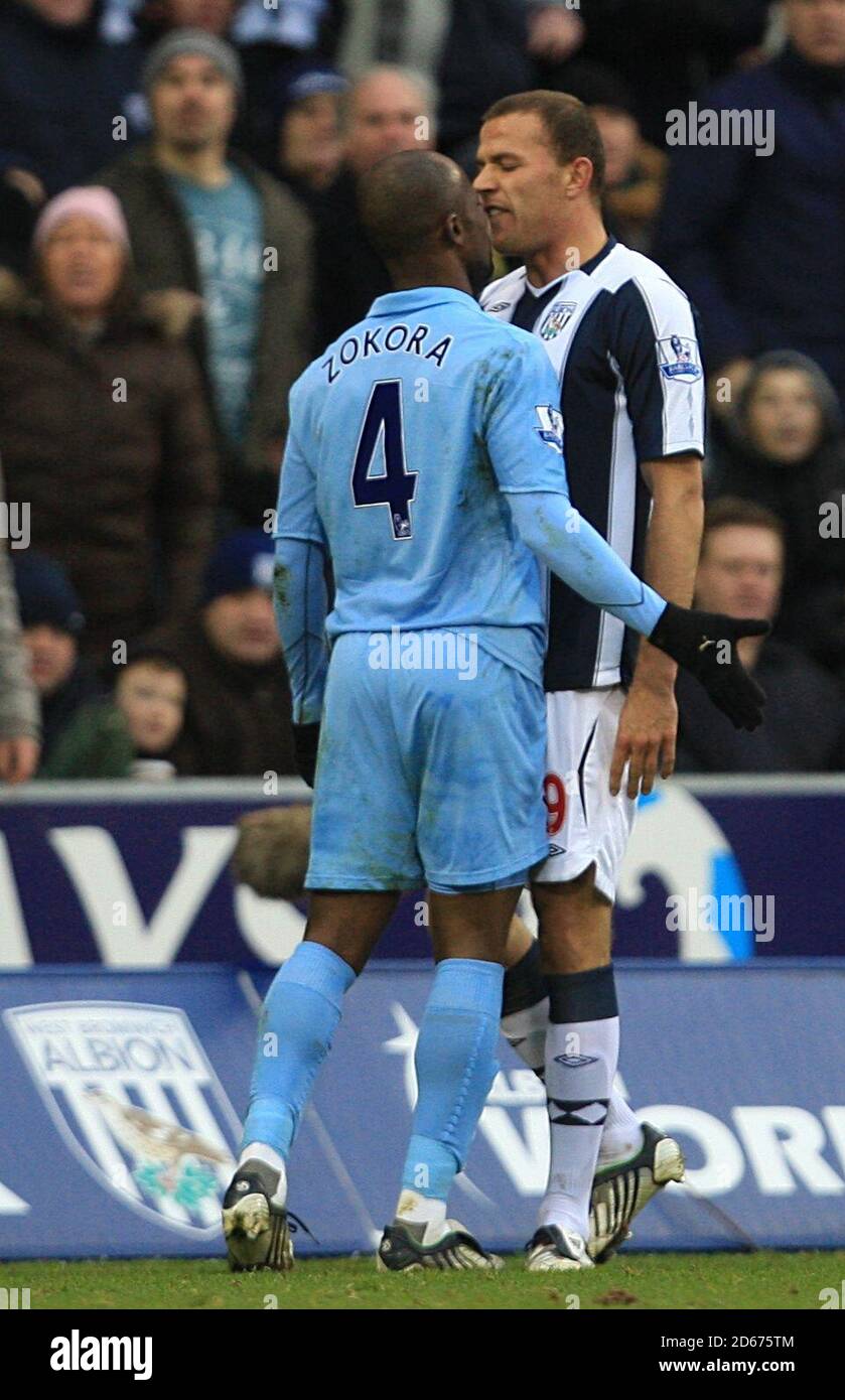 Tottenham Hotspur's Didier Zokora and West Bromwich Albion's Roman Bednar square up to one another during the game Stock Photo