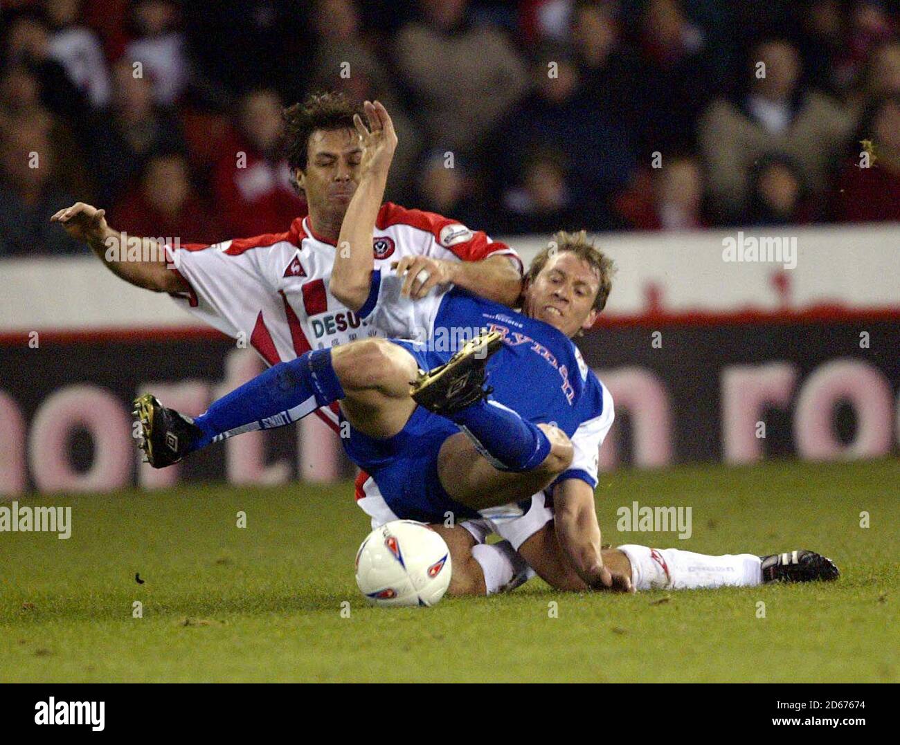 Sheffield United's Ashley Ward takes away the legs of Millwall's David ...