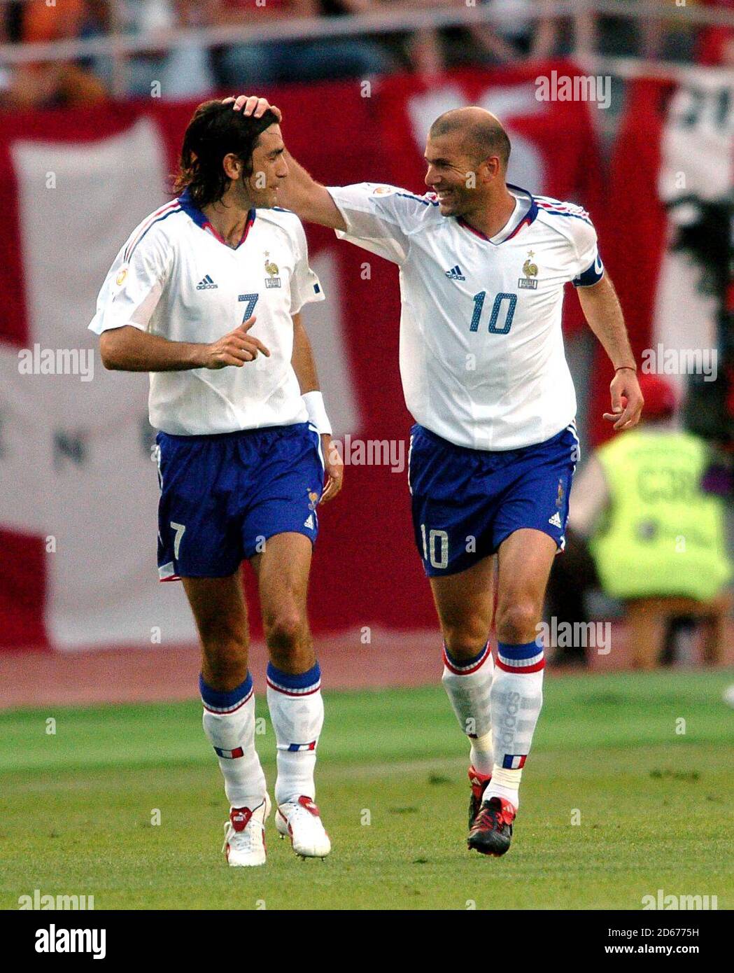 France's Zinedine Zidane celebrates scoring the opening goal with teammate Robert Pires (l) Stock Photo