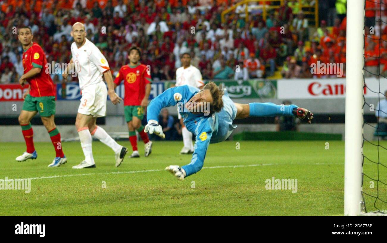 Holland's Edwin van der Sar dives but fails to stop Portugal's Maniche from scoring Stock Photo