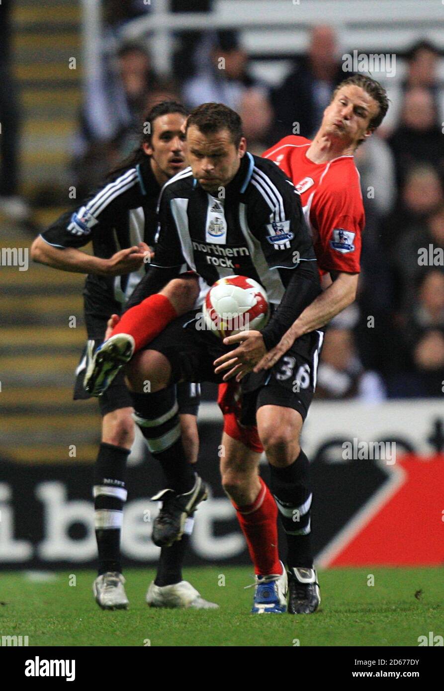 Newcastle United's Mark Viduka (left) and Middlesbrough's Robert Huth (right) battle for the ball Stock Photo